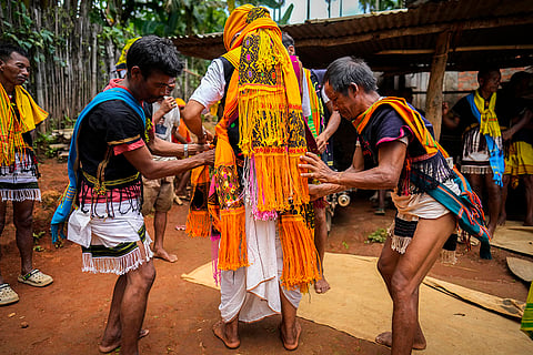 A Tiwa tribal boy wears traditional attire